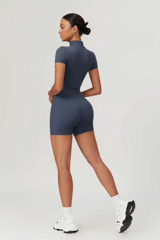 Nude One-Piece Yoga Jumpsuit — Half-Zip, Short Sleeve, Tight Fit