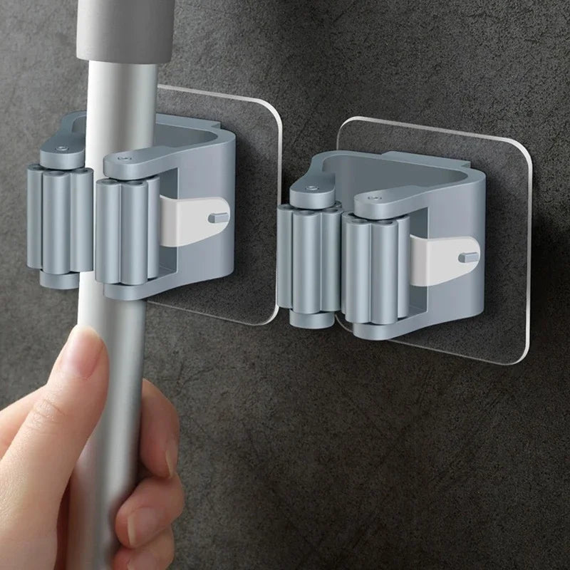 Wall-Mounted Mop & Broom Holder – Storage rack with hooks.